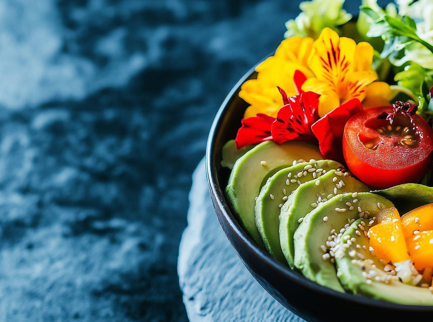 Colorful nourishing salad bowl with avocado slices tomato yellow peppers sesame seeds and edible flowers