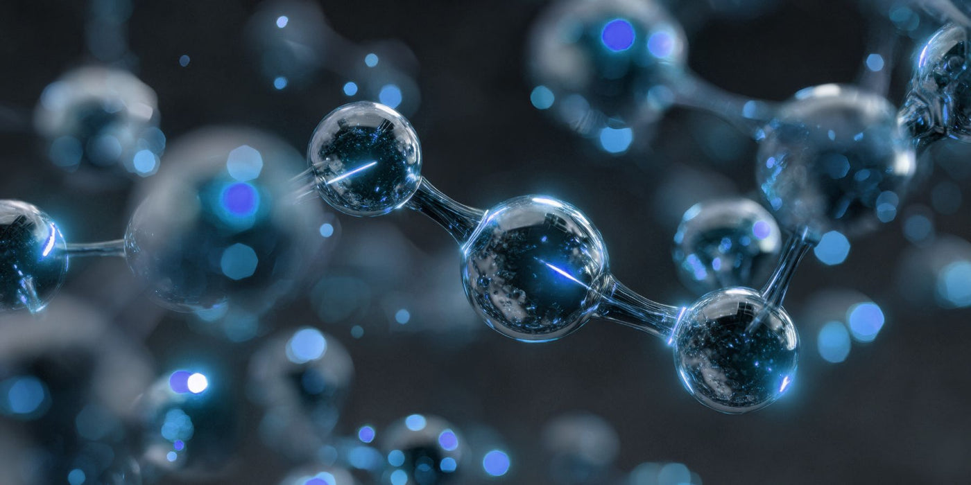 Close up of a blue glass molecular model with connected spheres and bonds.