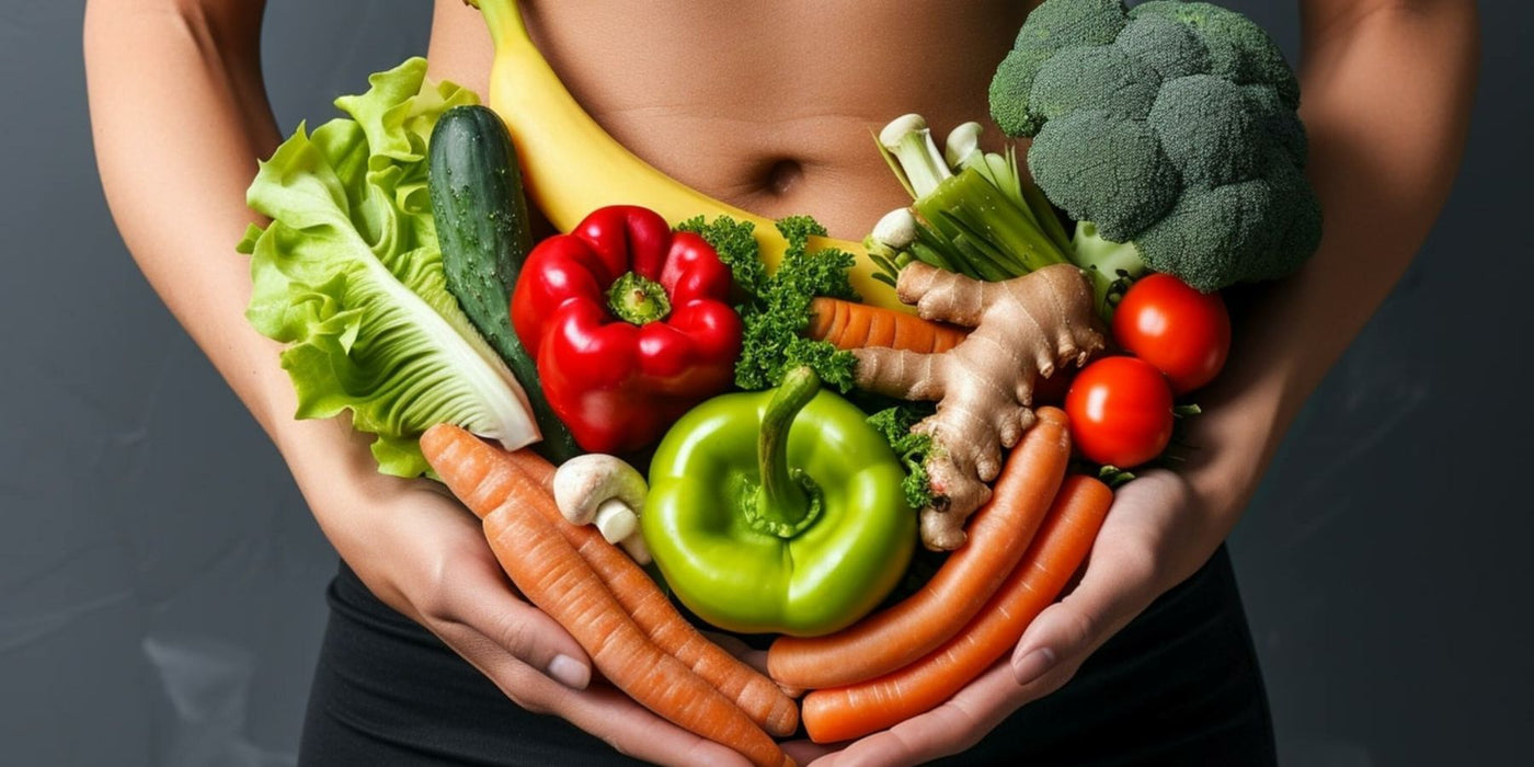 Person holding a colorful assortment of fresh vegetables including peppers, greens, and carrots