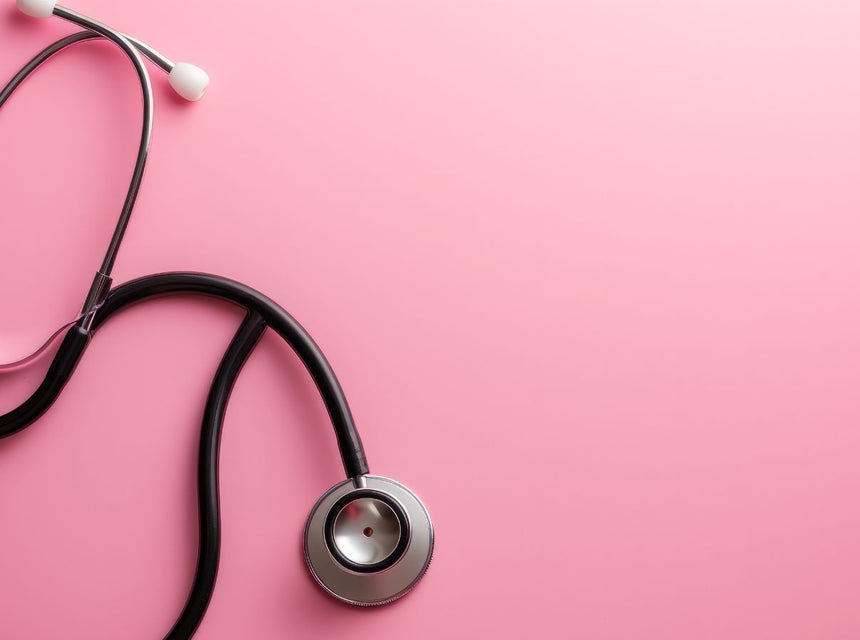 Stethoscope resting on a pink background, symbolizing heart health.