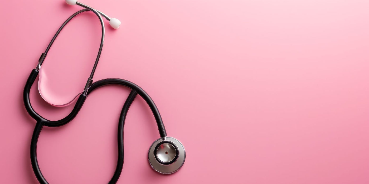 Stethoscope resting on a pink background, symbolizing heart health.