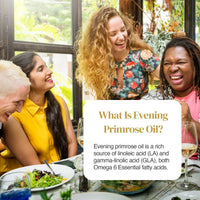 Diverse group of women laughing together at a sunlit dining table during a meal