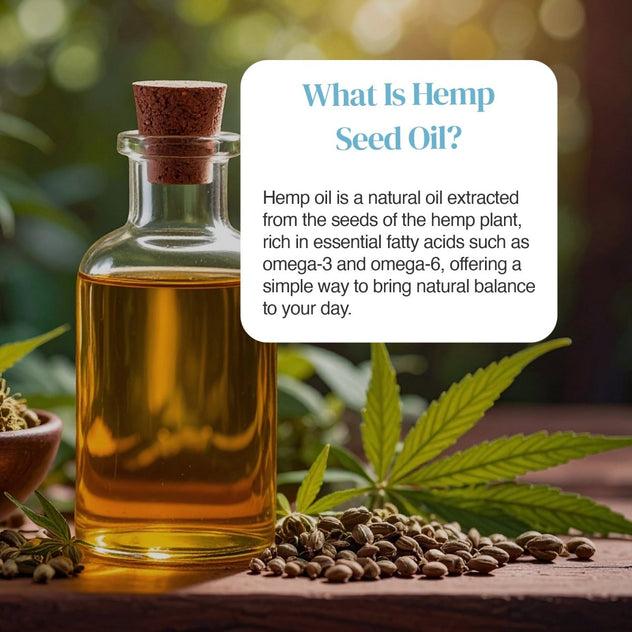 Glass bottle of hemp seed oil with cork stopper surrounded by hemp leaves and seeds on a wooden surface